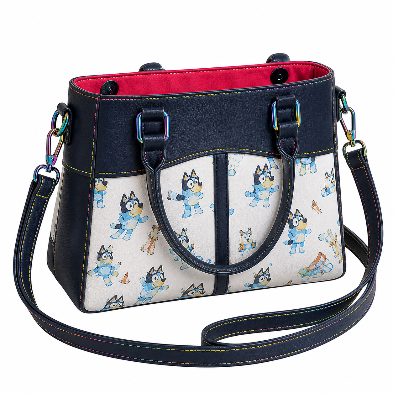 Bluey-inspired Regan handbag with navy faux leather, colorful stitching, rainbow hardware, and structured tote silhouette on a white background.