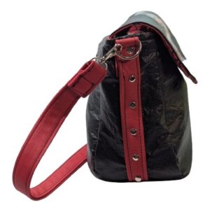 Side profile of Charlotte crossbody bag showing structured shape and adjustable crossbody strap.