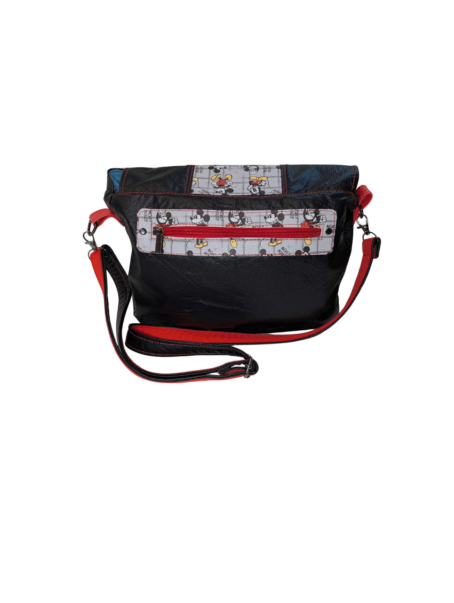 Back of printed crossbody handbag with red exterior zipper pocket