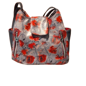 Floral hobo handbag with front flap and vertical zipper accents.