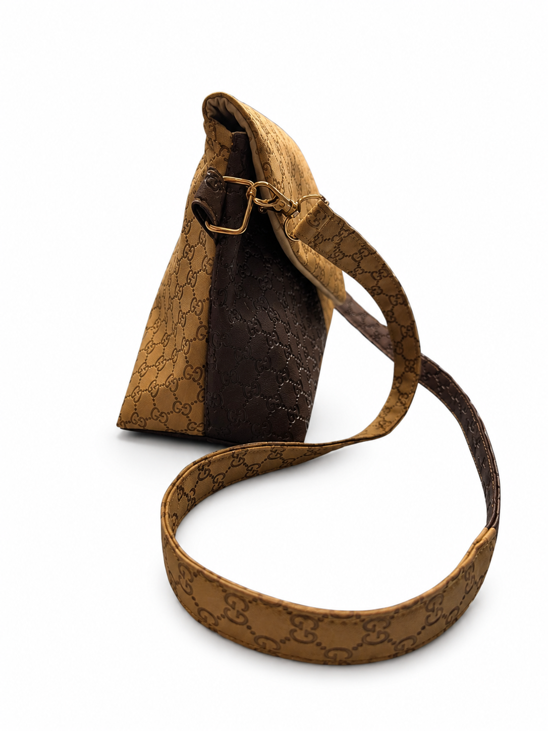 Angled front view of a handmade envelope crossbody purse with beige and brown faux leather and coordinating shoulder strap.