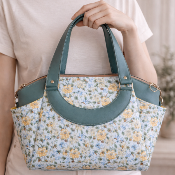 floral crossbody handbag worn on model green purse
