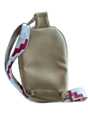 Back view of neutral La Bubu sling bag with adjustable patterned crossbody strap and smooth faux leather exterior.