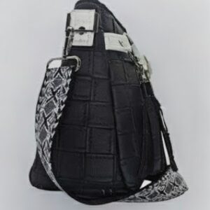 black faux leather crossbody handbag worn on model adjustable strap