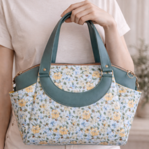 floral crossbody handbag worn on model green purse