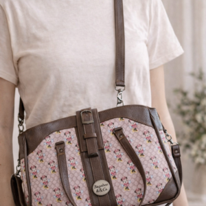 printed crossbody handbag worn on model adjustable strap purse