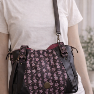 floral crossbody handbag worn on model brown faux leather purse