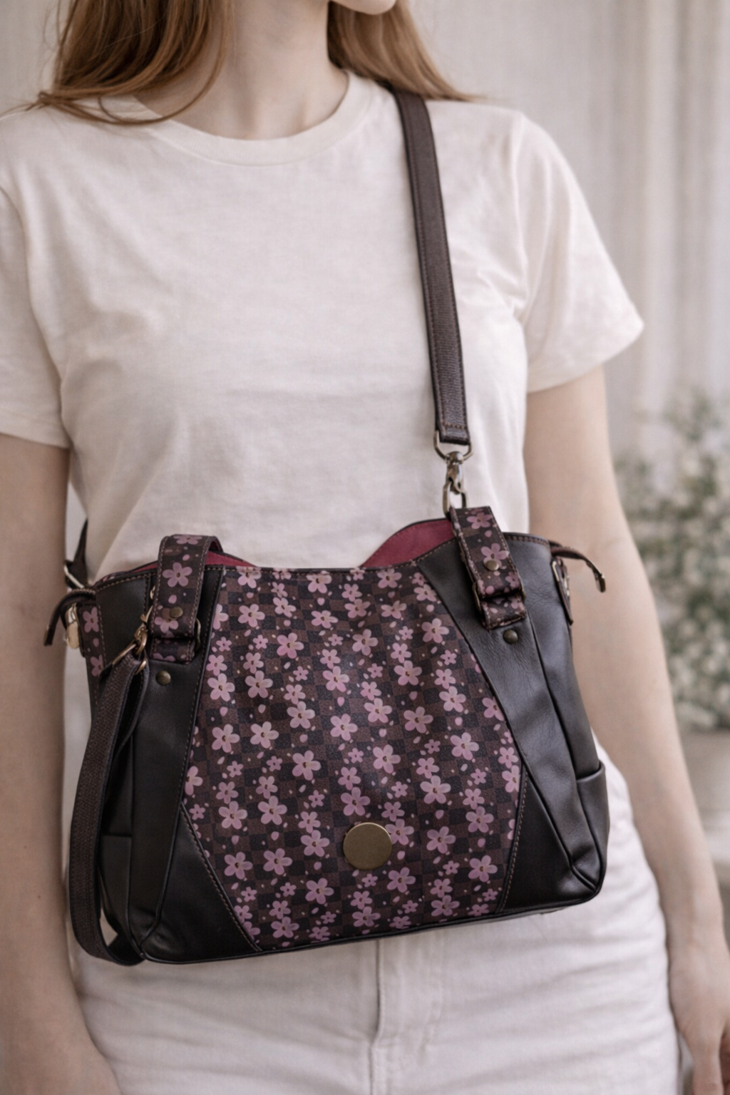 floral crossbody handbag worn on model brown faux leather purse