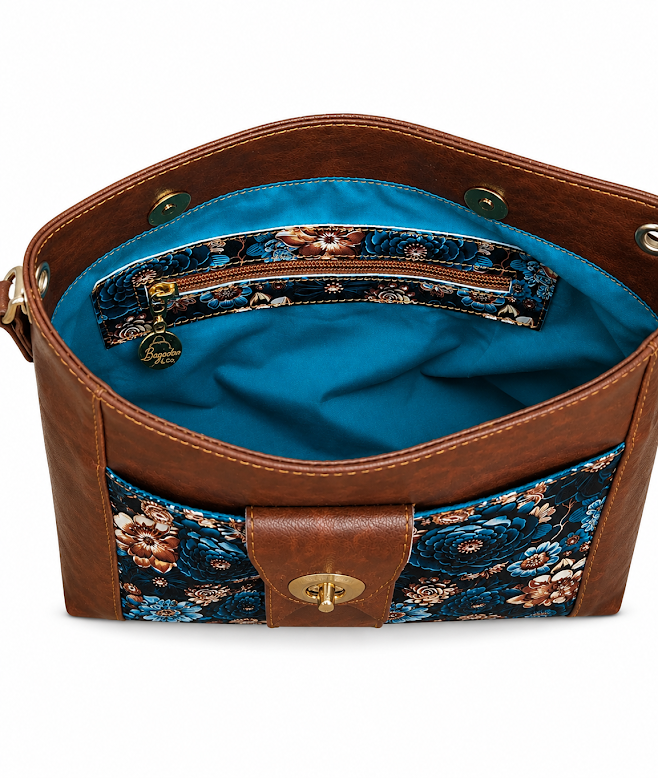 Interior zippered pocket and turquoise lining inside handmade floral crossbody bag