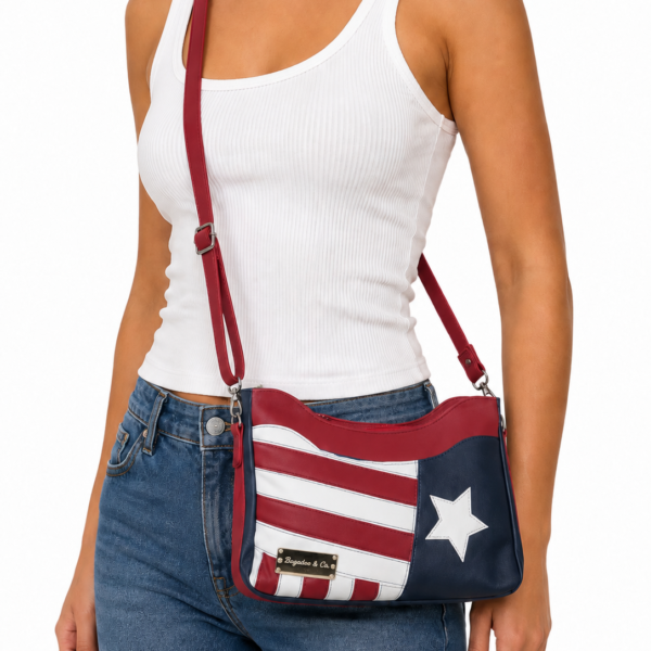 Handmade patriotic crossbody purse in red, white, and blue faux leather worn as a crossbody bag on a model, featuring a star and striped American flag-inspired design.