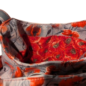 Interior of handmade floral handbag showing multiple slip pockets and coordinating floral lining by Bagadoo & Co.