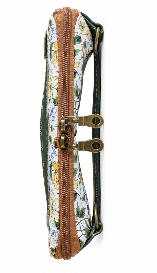 Slim side profile of handmade green floral wallet clutch with faux leather accents