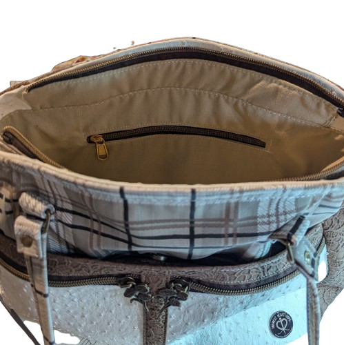 Interior zipper pocket inside neutral plaid handbag with spacious organized storage.