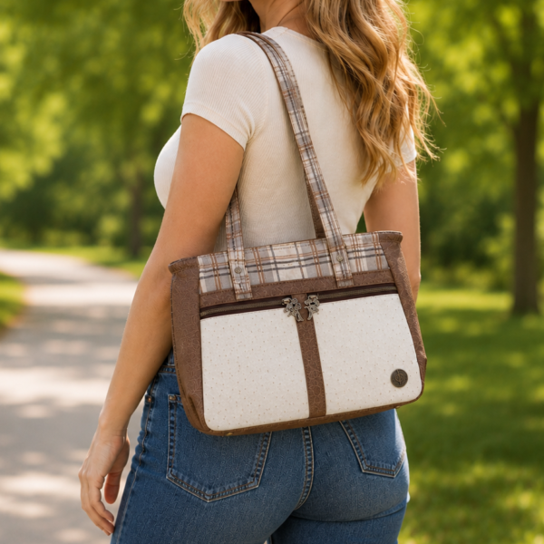 Handmade neutral plaid tote handbag featuring cream faux ostrich leather, brown faux leather accents, and plaid fabric with double shoulder straps.