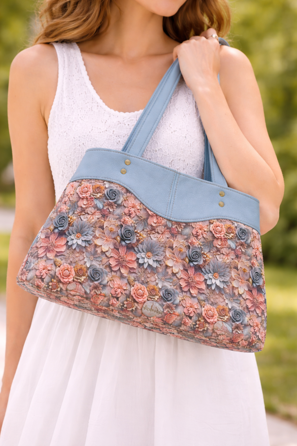 floral sweetheart handbag blue faux leather shoulder bag worn on model