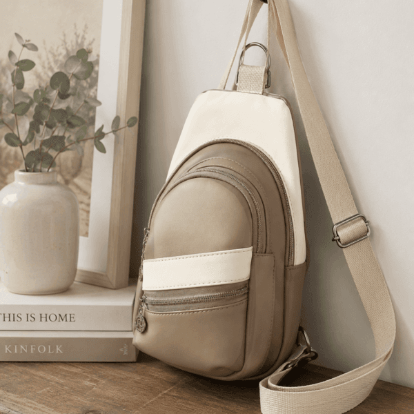 Custom handmade mini sling bag displayed in a neutral home setting.