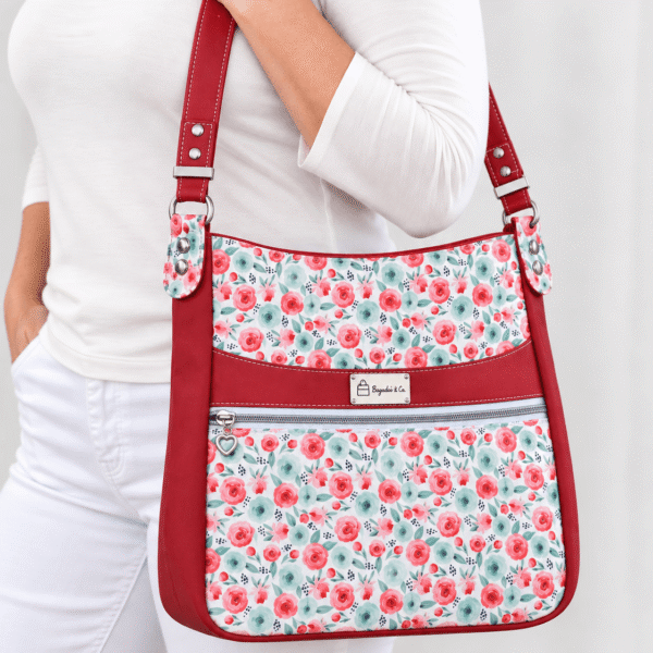 Woman wearing a red and mint floral organizer tote bag with shoulder strap