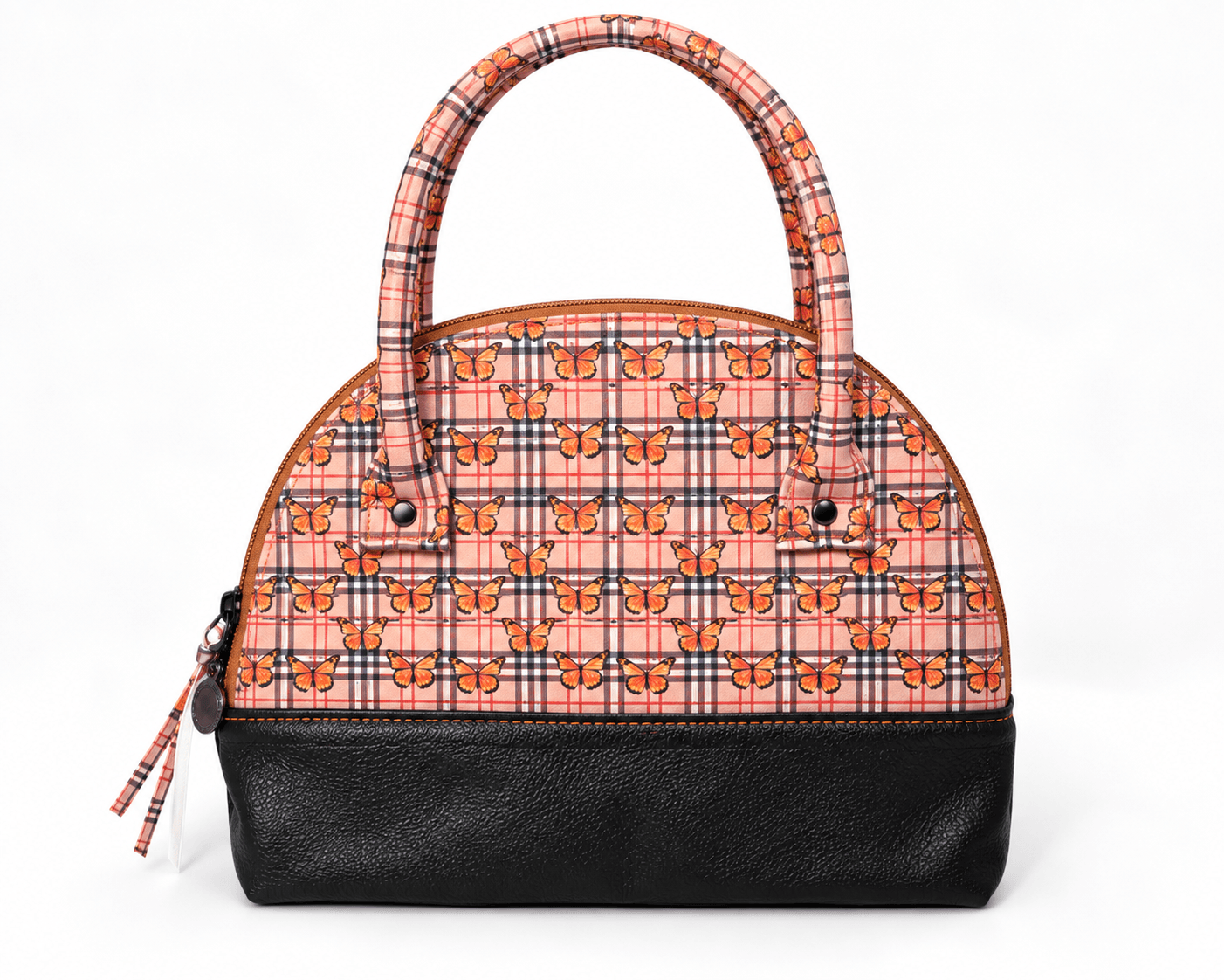 Back of handmade orange butterfly plaid handbag with matching fabric handles and black faux leather base.