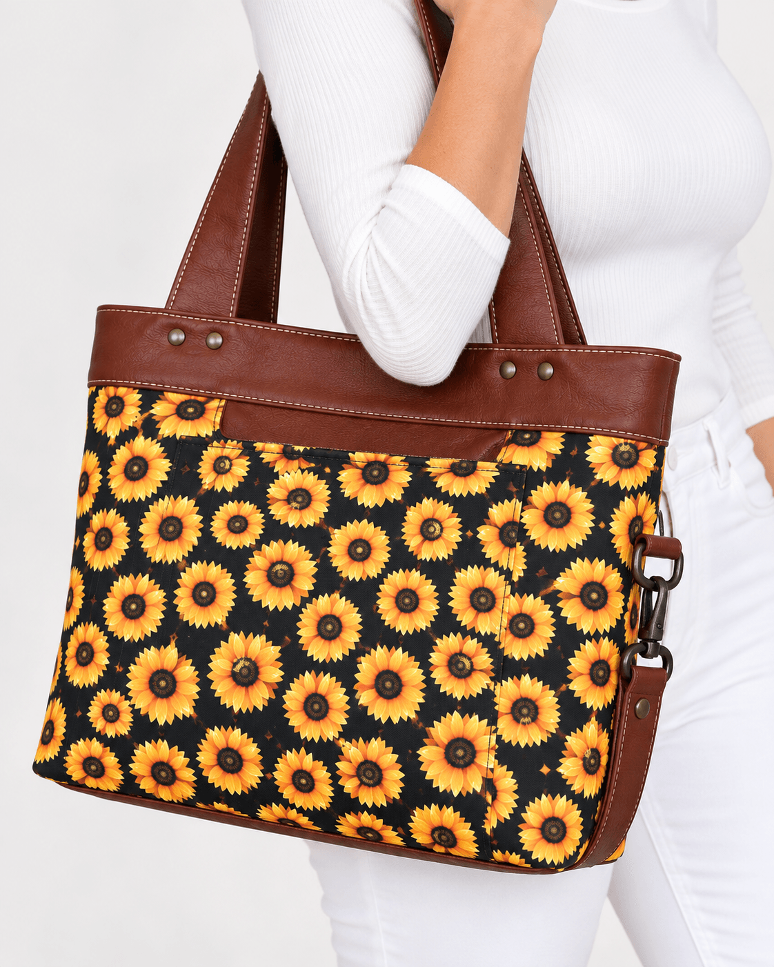 Model wearing a handmade sunflower tote bag with brown trim and handles