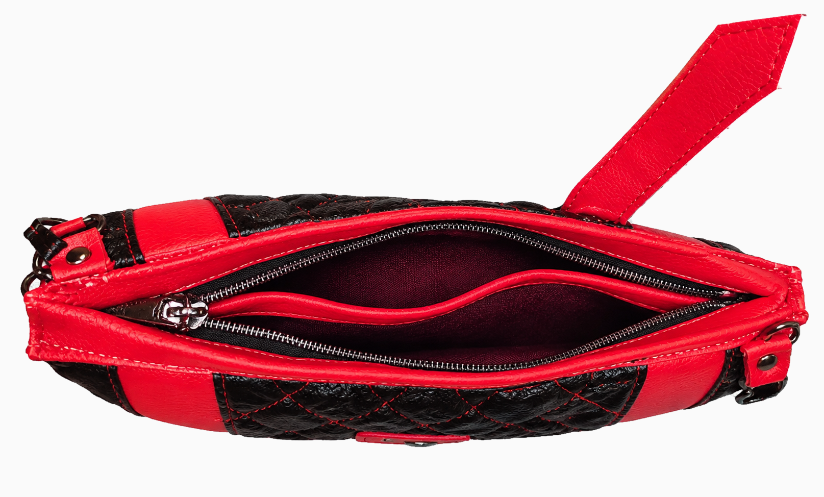 Open red and black quilted wristlet showing dark fabric lining, interior divider pocket, and zippered opening.